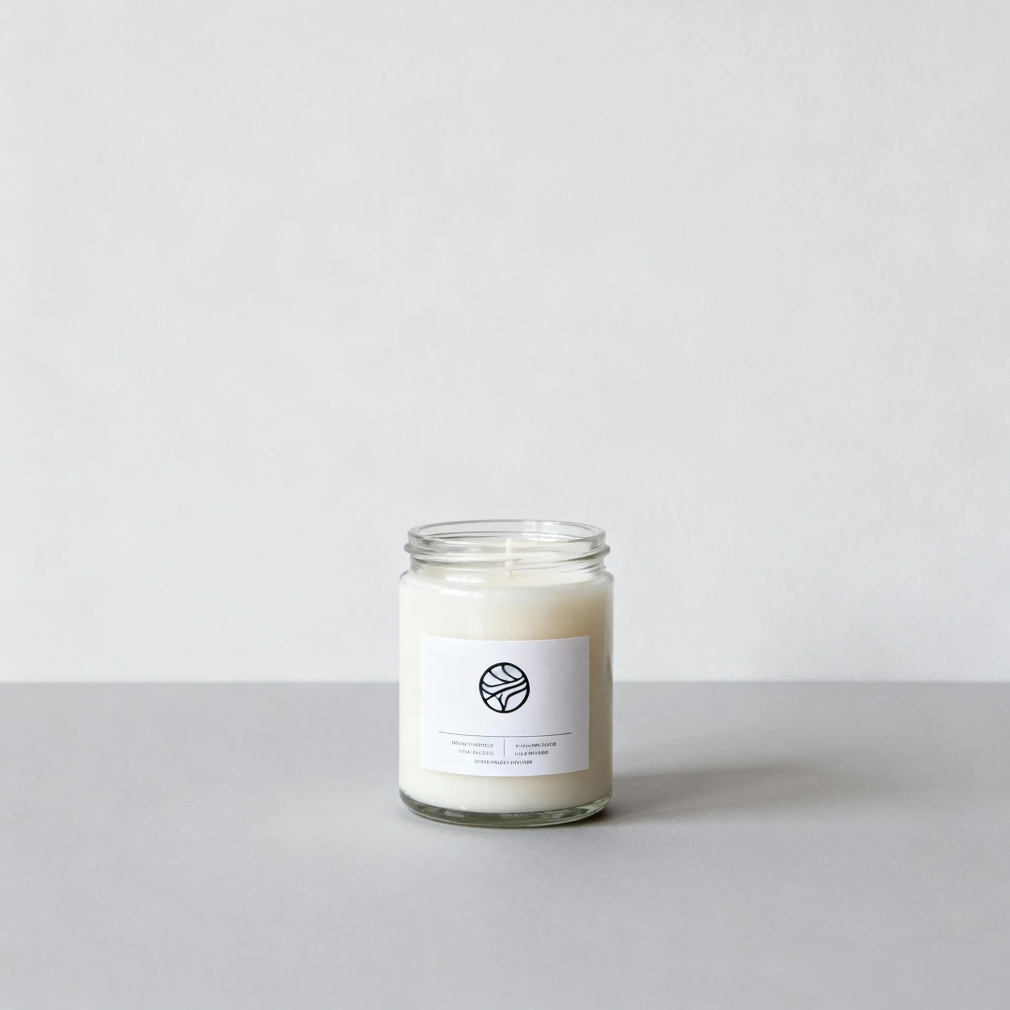 Plain scented candle product photo on neutral gray background with simple lighting