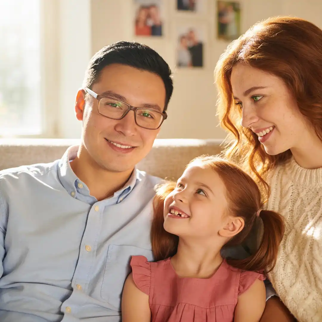 Original family photo before transformation showing three family members with distinct features